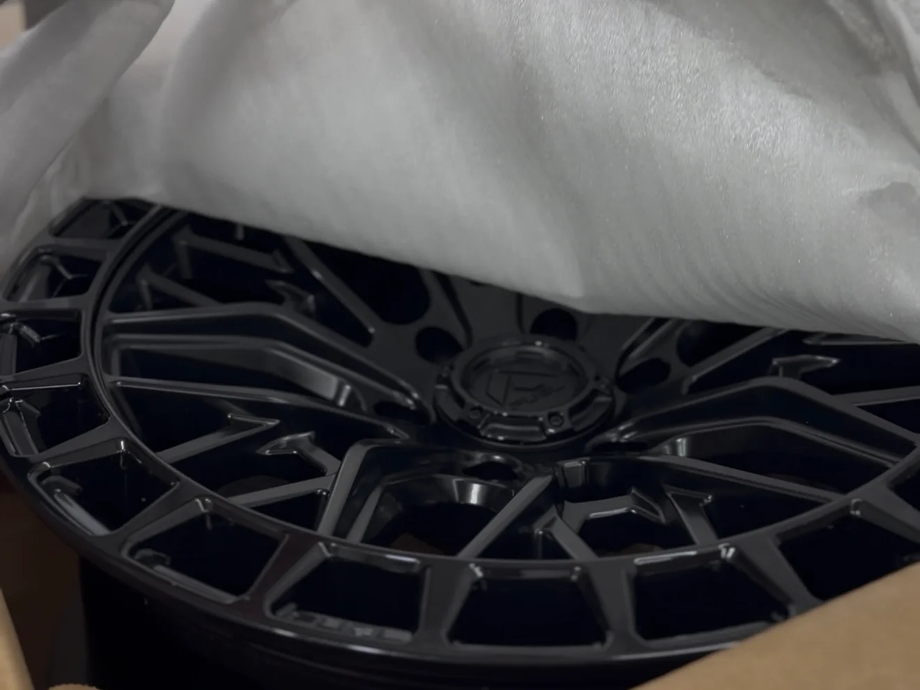 Truck on aftermarket wheels by DC Custom Wraps